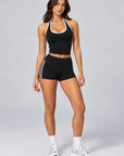 Black contrast halter singlet styled with matching Contrast Stripe Sculpt Shorts, full length front