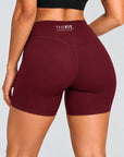 Burgundy sculpt bike shorts, back close-up showing V-seam and THE FIT. COLLECTION logo