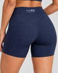 Navy sculpt bike shorts, back close-up showing V-seam and THE FIT. COLLECTION logo