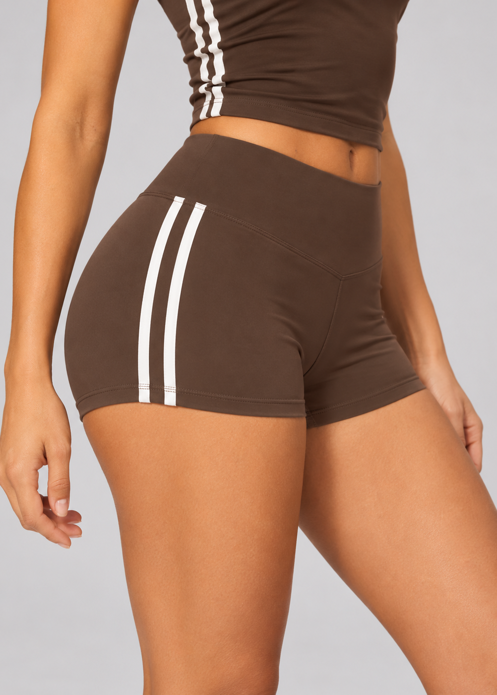 Contrast stripe sculpt shorts in chocolate brown with cream side stripes, front view