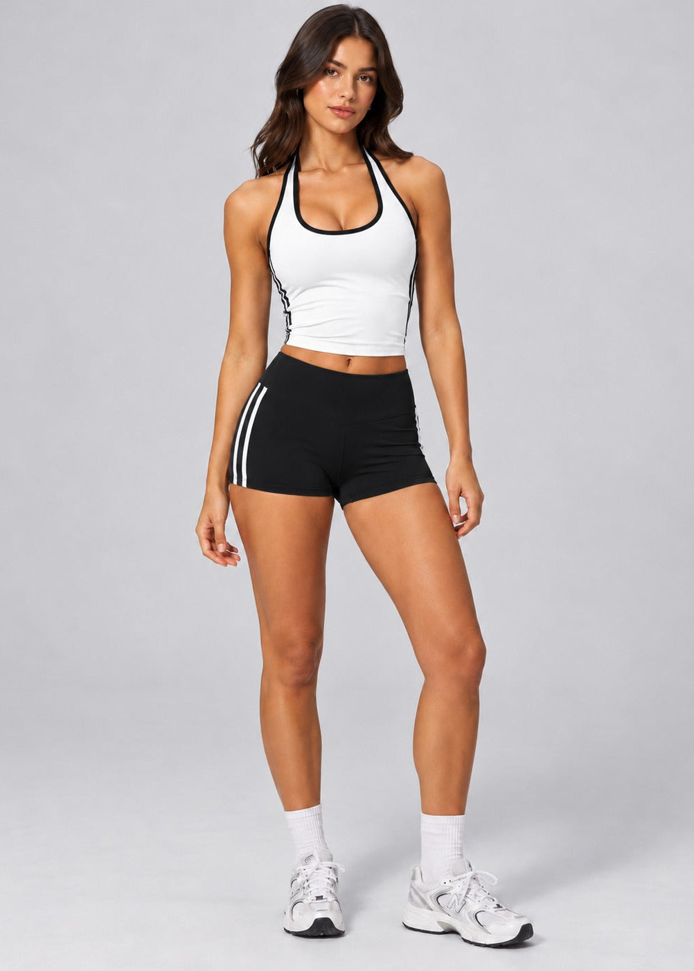 White contrast halter singlet styled with black Contrast Stripe Sculpt Shorts, full length front