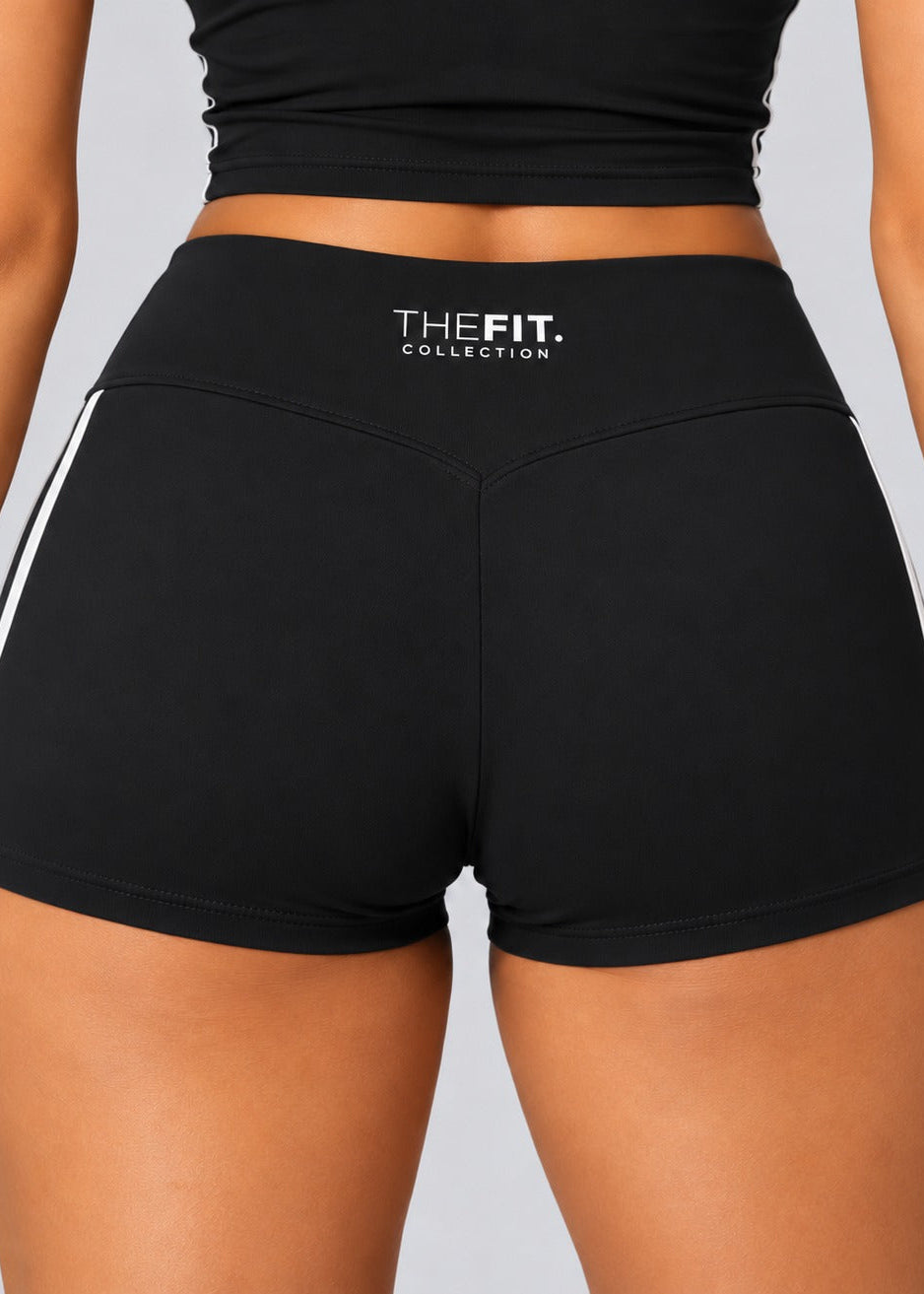 Back of black sculpt shorts with V-shaped seam and THE FIT. COLLECTION logo
