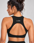 Black crop top back view showing racer back, teardrop cut-out and THE FIT. COLLECTION logo