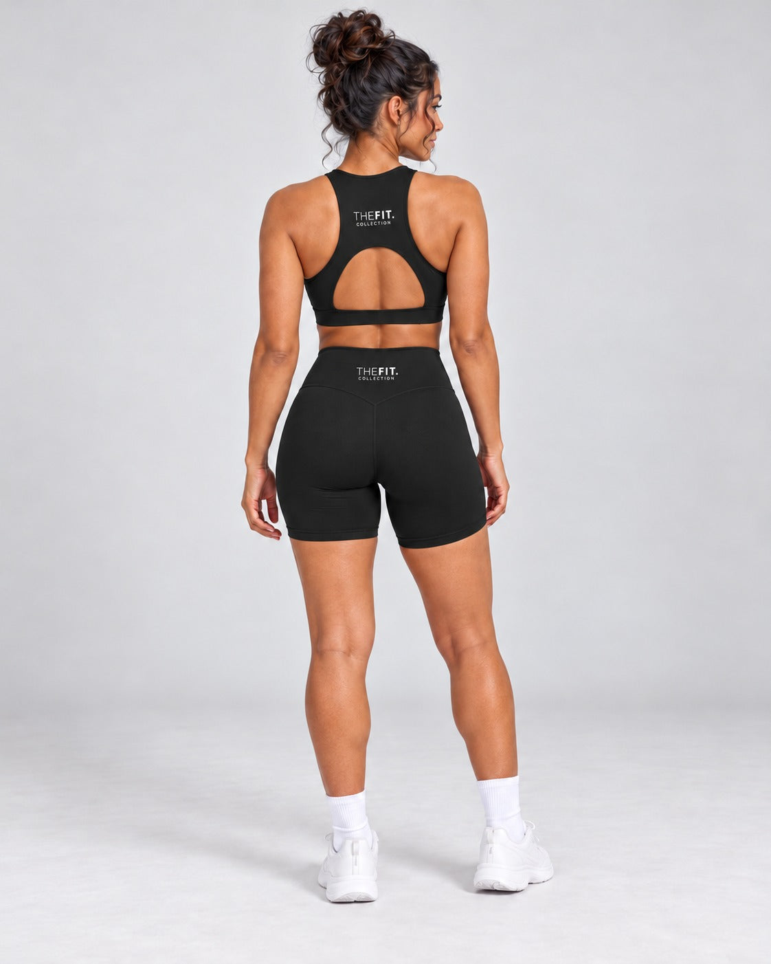 Black crop top and bike shorts set, full length back view