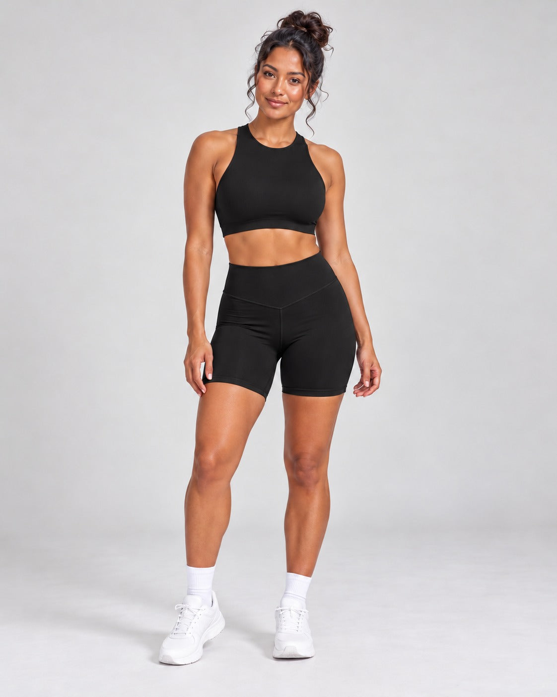 Black Sculpt Open-Back Crop Top styled with matching Sculpt Bike Shorts, full length front