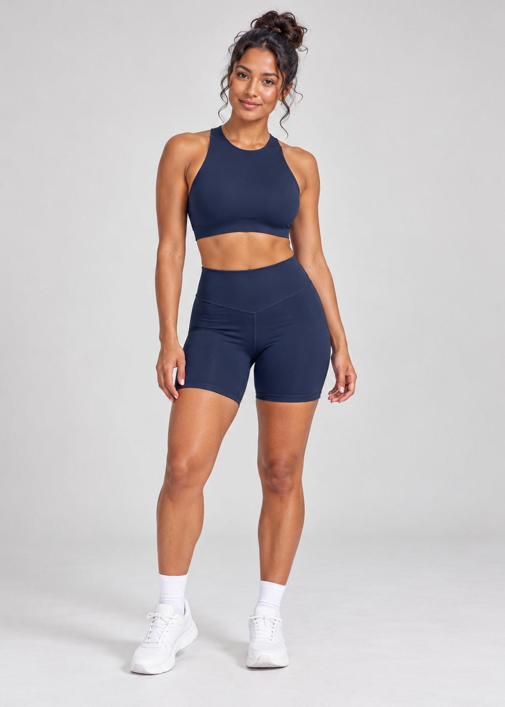 Navy Sculpt Open-Back Crop Top styled with matching Sculpt Bike Shorts, full length front
