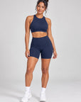 Navy Sculpt Open-Back Crop Top styled with matching Sculpt Bike Shorts, full length front